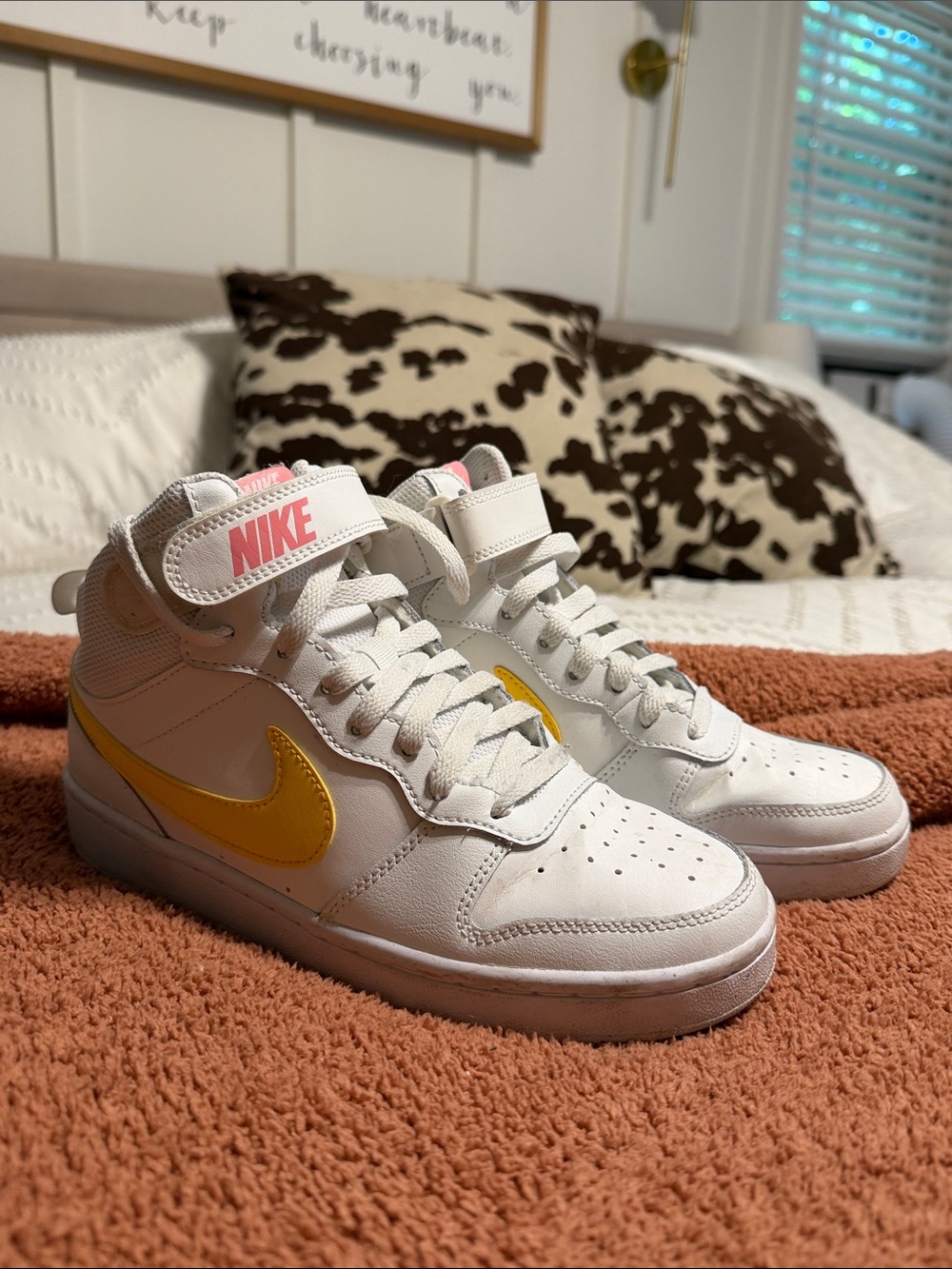Nike White Mid-Top Sneakers with Yellow Swoosh